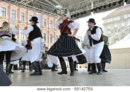 ZAGREB, CROATIA - JULY 19: Members of folk group Seljacka sloga from Donja Dubrava, Croatia during the 48th International Folklore Festival in center of Zagreb, Croatia on July 19, 2014