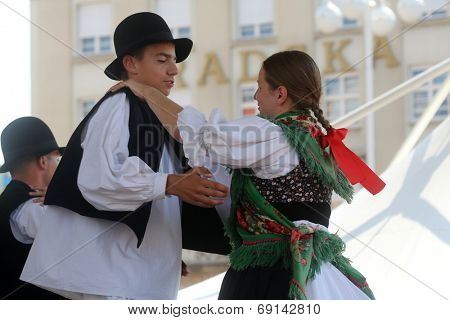 ZAGREB, CROATIA - JULY 19: Members of folk group Seljacka sloga from Donja Dubrava, Croatia during the 48th International Folklore Festival in center of Zagreb, Croatia on July 19, 2014