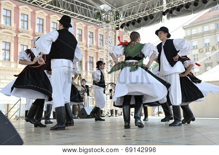ZAGREB, CROATIA - JULY 19: Members of folk group Seljacka sloga from Donja Dubrava, Croatia during the 48th International Folklore Festival in center of Zagreb, Croatia on July 19, 2014