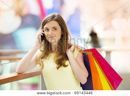 Shopping girl with smartphone