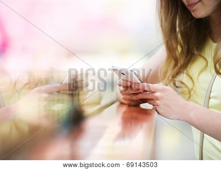 Shopping girl with smartphone