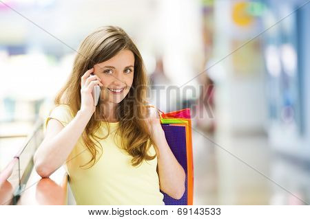 Shopping girl with smartphone