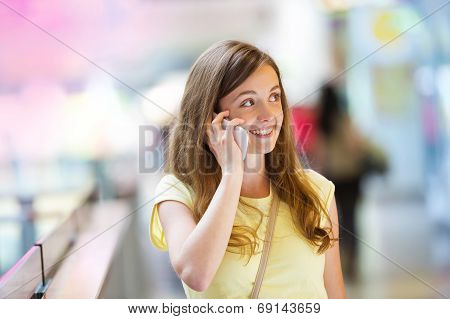 Shopping girl with smartphone