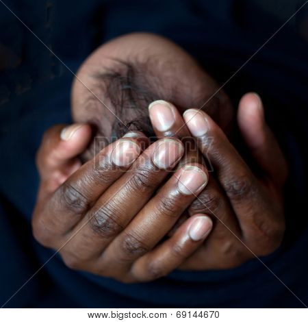Black Father Holding Newborn Baby