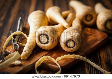 Fresh parsnip on wooden table