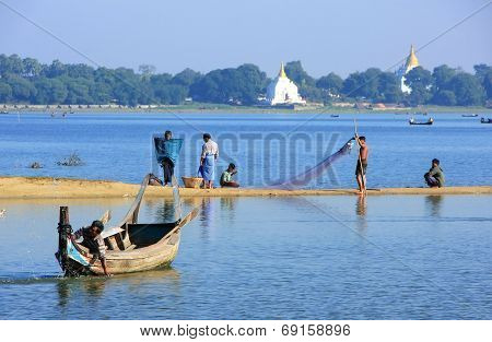 AMARAPURA, MYANMAR - DECEMBER 31: Unidentified people fish in a lake on December 31, 2011 in Amarapu