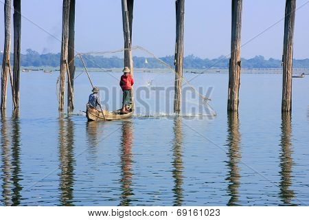 AMARAPURA, MYANMAR - DECEMBER 31: An unidentified man fishes in a lake on December 31, 2011 in Amara