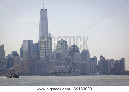 NEW YORK - MAY 27: USS Oak Hill (LSD 051) passes the Freedom Tower and financial district of Lower Manhattan after departing Pier 92 on the Hudson River at the end of Fleet Week NY on May 27, 2014.  