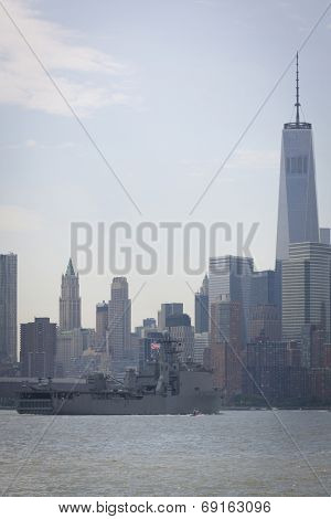 NEW YORK - MAY 27: USS Oak Hill (LSD 051) passes the Freedom Tower in the financial district of Lower Manhattan after departing Pier 92 on the Hudson River at the end of Fleet Week NY.  