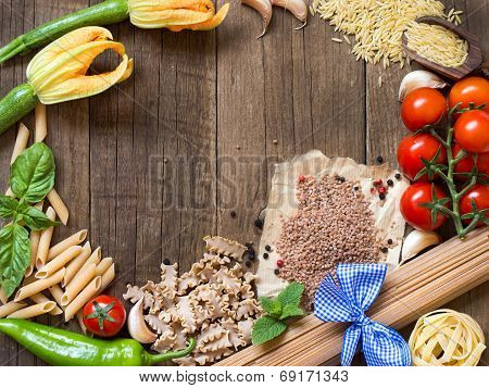 Pasta, Vegetables And Herbs On Wood