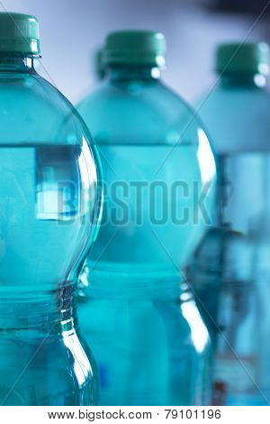 Isolated Plastic Water Bottles Blue Background Studio