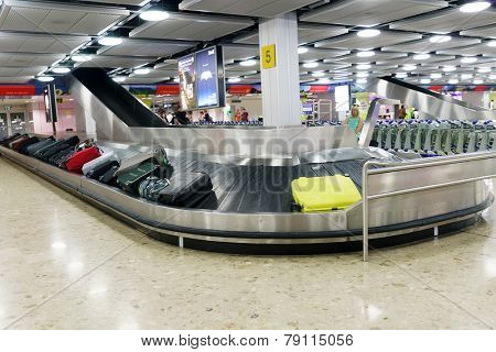 GENEVA - SEP 15: Baggage claim area on September 15, 2014 in Geneva, Switzerland. Geneva International Airport is the international airport of Geneva, Switzerland