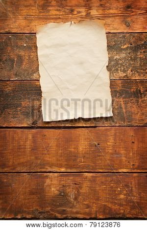 Old Worn Piece Of Paper Nailed To A Plank Door