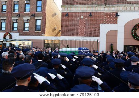 Saluting flag-draped coffin outside church