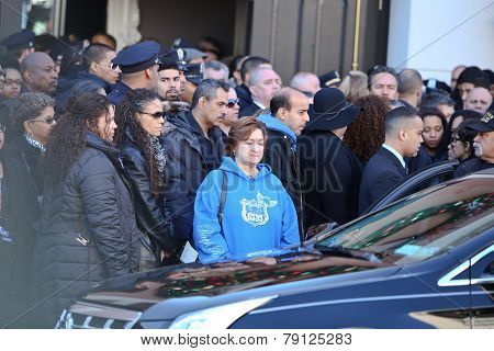 Mourners file out of church