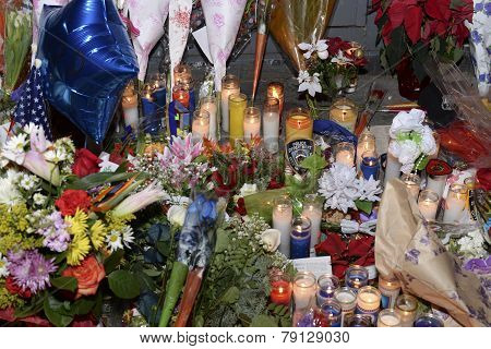 Flowers, candles & balloons at memorial
