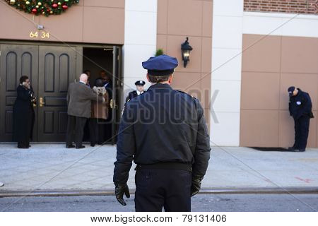 NYPD officer in front of church