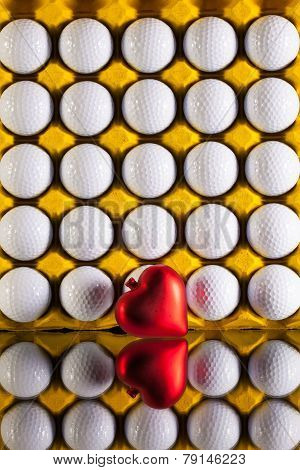 Golf Balls In Box For Eggs And Red Heart