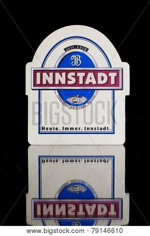 Beermat From Innstadt Beer On The Glass Desk