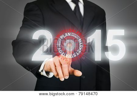 Businessman clicking on 2015 business target