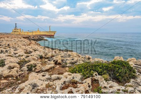 Ship Aground Near Rocky Coast