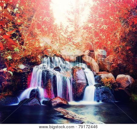  pretty waterfalls toned with a warm retro vintage instagram filter effect (slow shutterspeed for cascading water softening) 