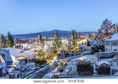 Snow Coverede Houses And Mountains In Schwalbach