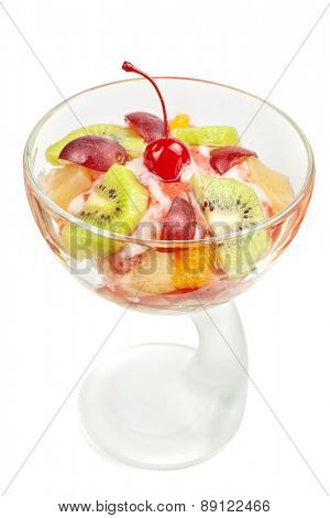 Fruit salad with ice cream in plate on white