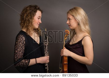 Shy Female Musicians Formally Dressed
