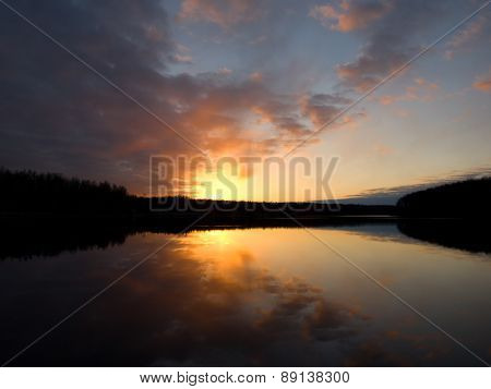 Dawn over the forest lake