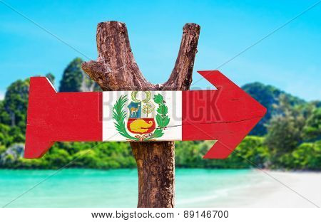 Peru Flag wooden sign with beach background
