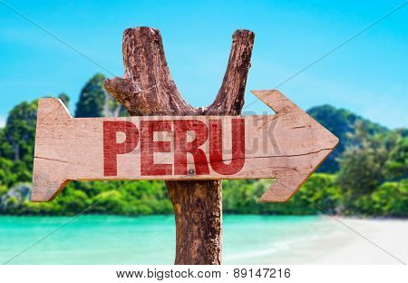 Peru wooden sign with beach background