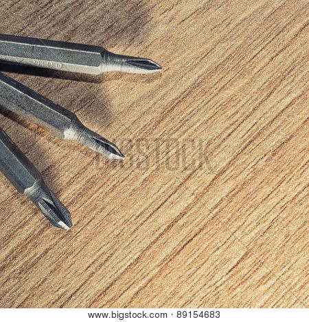 Screwdrive Replaceable Bits On A Wooden Background