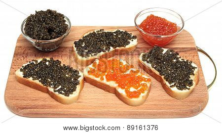 Black and red caviar in glass container
