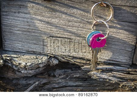 Keys Hanging On Old Wooden Wall