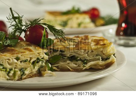 Turkish breakfast borek isolated on white background