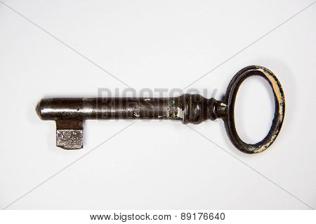 Vintage Key To The Safe On A White Background