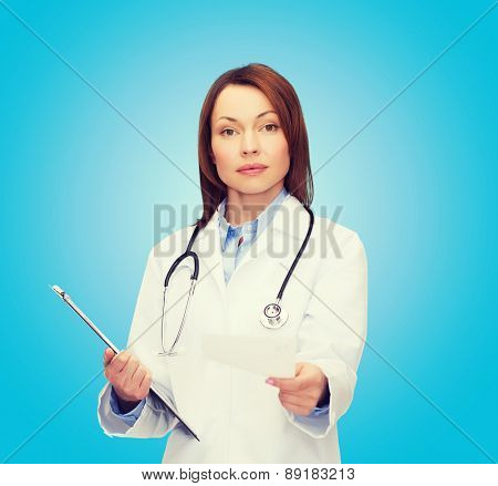 healthcare and medicine concept - calm female doctor with clipboard and stethoscope