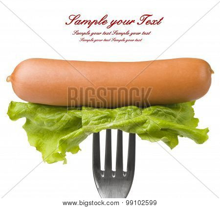 Close up of sausage and fork isolated on white background