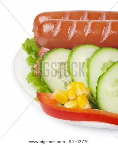 Close up of sausage and fresh vegetables