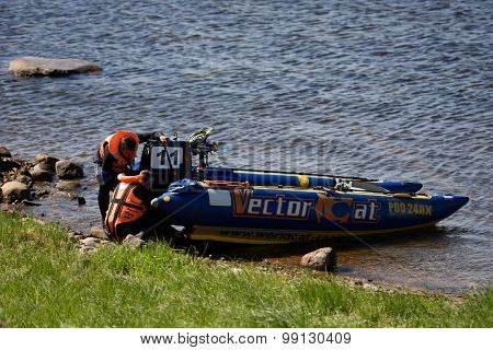 ORESHEK FORTRESS, LENINGRAD OBLAST, RUSSIA - AUGUST 15, 2015: Athletes after the fist stage of the River marathon Oreshek Fortress race. This international motorboat competitions is held since 2003