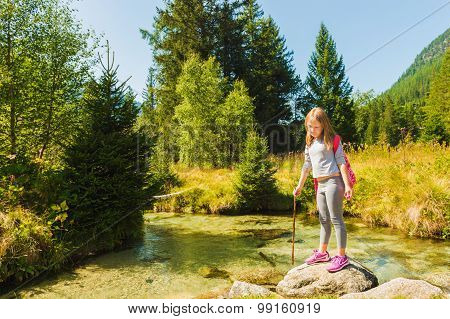 Little hiker girl in forest. Photo from Champex-Lac, Valais, swiss Alps