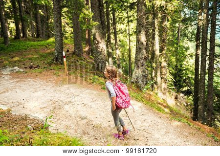 Little hiker girl in forest. Photo from Champex-Lac, Valais, swiss Alps