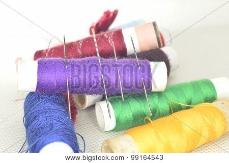 Colored Threads With Needles And Blade
