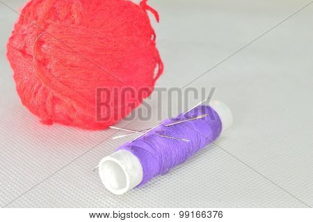 Purple Yarn And Red Clew