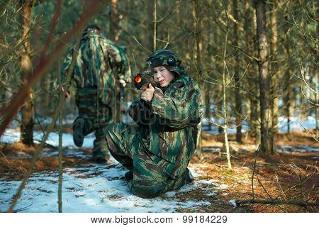 boys playing with gun during laser tag