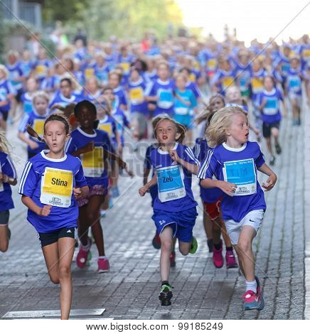 Large Group Of Running Girls And Boys