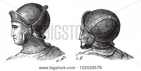 Old engraved illustration of legionary helmets isolated on a white background. Industrial encyclopedia E.-O. Lami 1875.