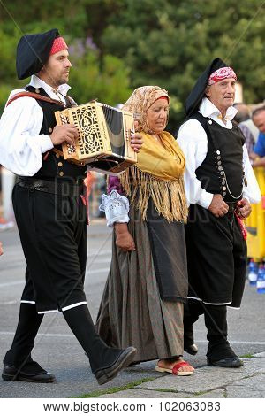 Musicians With The Traditional Costume Of Sardinia.