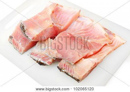 Carp fillet on white background. In Central Europe ( Poland and Czech Republic ), fish is a traditional part of a Christmas Eve dinner. 